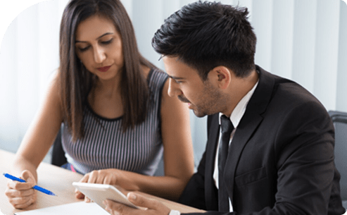 Two professionals discussing on tablet